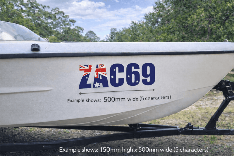 Boat with a decal showing the Australian flag and text 'ZAC69' against a natural background.