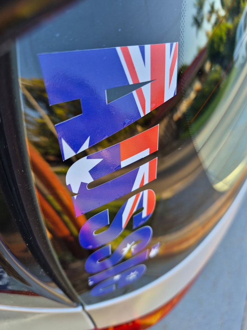 Car window with 'AUSSIE' decal featuring the Australian flag