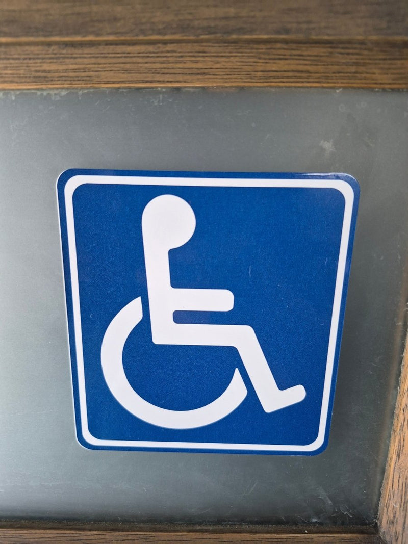 Handicap access sign on a gray background