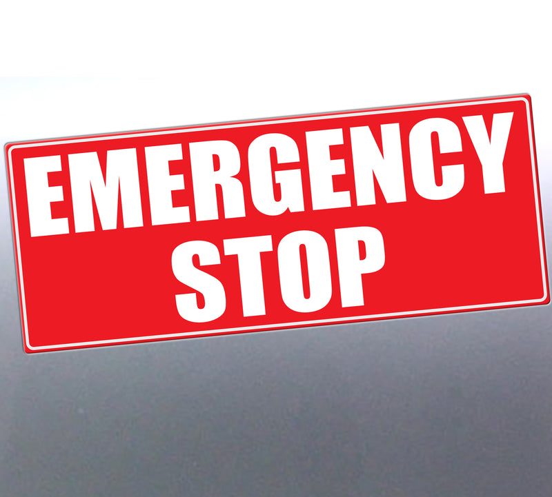 A rectangular red emergency stop Sticker/sign with bold white text reading 'EMERGENCY STOP' on a dark gray background.