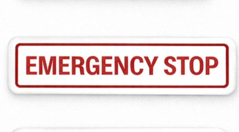 Rectangular red 'EMERGENCY STOP' sign on a white background