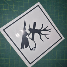 Load image into Gallery viewer, Sticker with a black silhouette of a tree, bird, and lightning bolt on a white background, placed on a green cutting mat.

