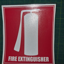 Load image into Gallery viewer, Fire extinguisher sign on a red background with white text and symbol, placed on a green cutting mat.
