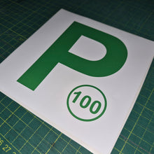Load image into Gallery viewer, Green 'P' and number 100 sign on a white background, placed on a green cutting mat.
