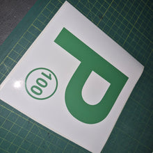 Load image into Gallery viewer, Green 'P' with number 100 on a white background on a green cutting mat.
