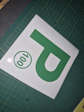 Load image into Gallery viewer, Green 'P' with number 100 on a white background on a green cutting mat.
