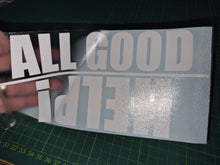 Load image into Gallery viewer, Decal with 'ALL GOOD THINGS' text held over a cutting mat
