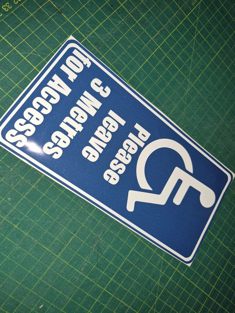 Handicap access sign with text on a green grid background