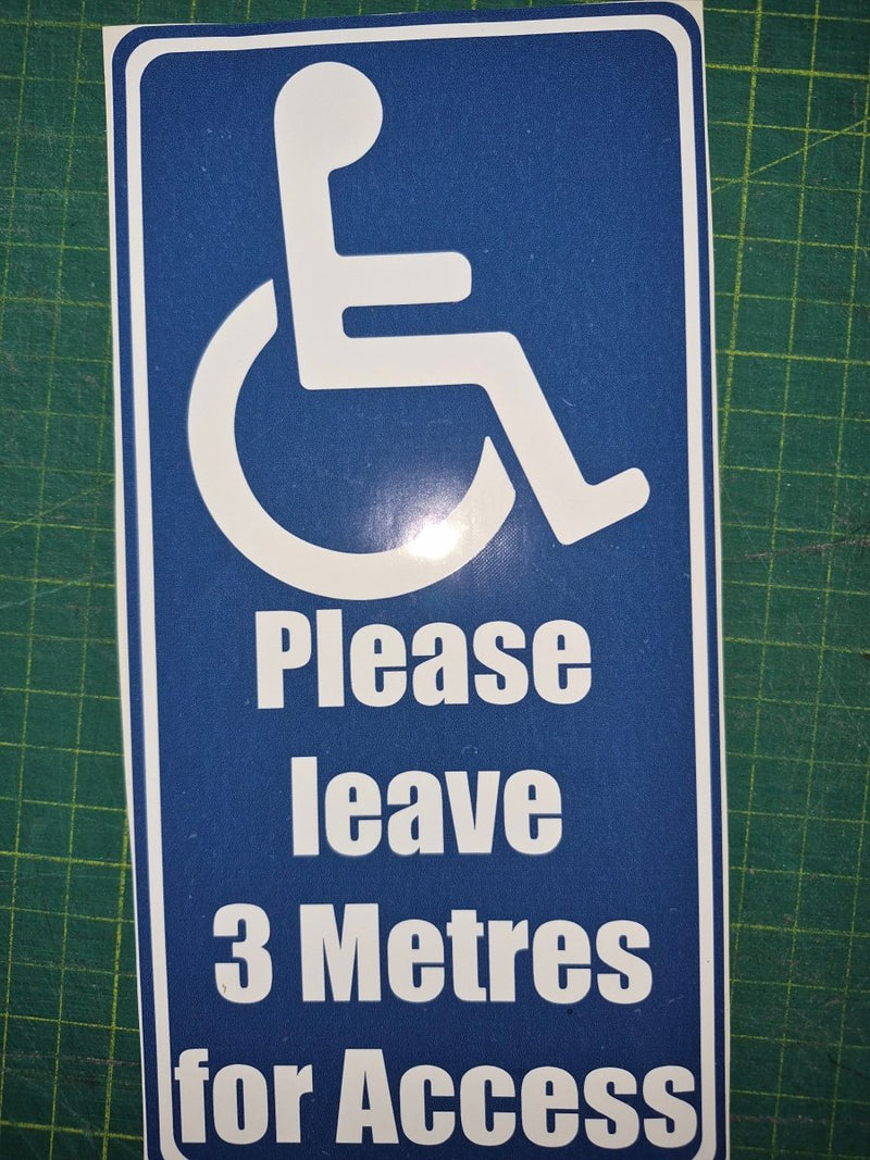 Handicap access sign with text 'Please leave 3 Metres for Access' on a blue background.