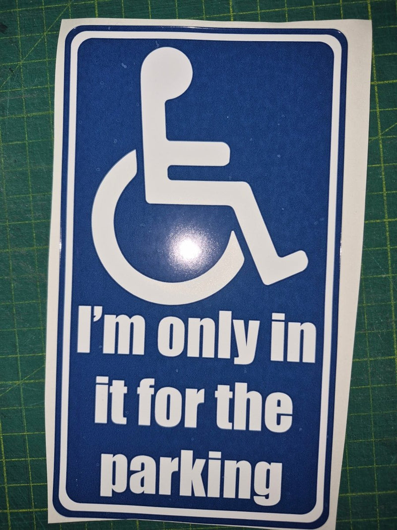 Handicap parking sign with humorous text on a green cutting mat