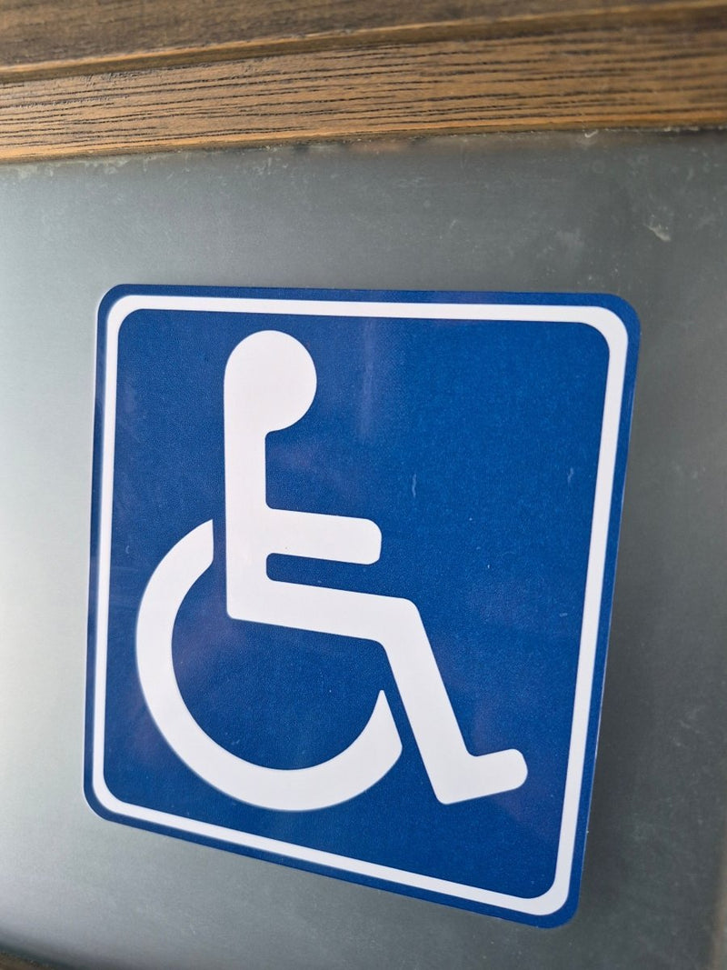 Handicap access sign on a metallic surface