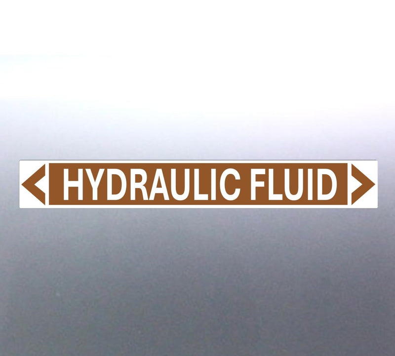 A rectangular brown label with the text 'HYDRAULIC FLUID' in bold white letters, surrounded by a white border and green arrows at the ends.