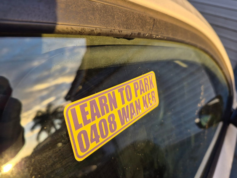 Learn to park wanker Yellow and black sticker on side door window