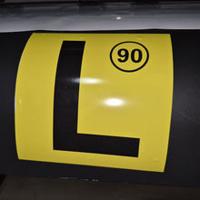 Load image into Gallery viewer, Yellow and black traffic sign with number 90 on a dark surface
