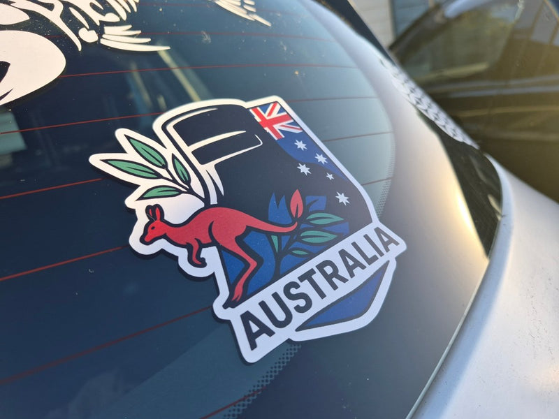 Ned Kelly Australia-themed car decal with kangaroo and Australian flag on a vehicle window.