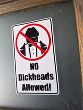 Load image into Gallery viewer, Sticker with a 'No dickheads allowed!' message on a metallic surface.
