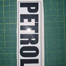 Load image into Gallery viewer, Sticker with 'PETROL' text on a green cutting mat
