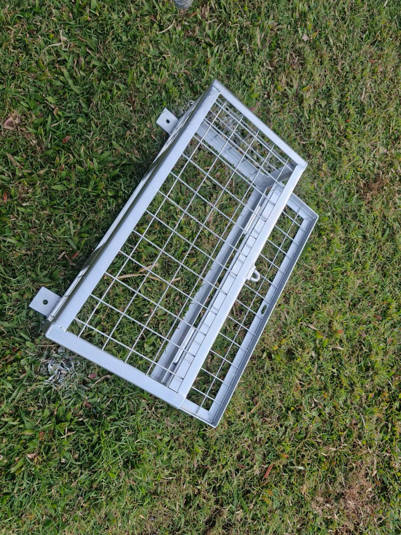 Plumbers cage getting painted on grass