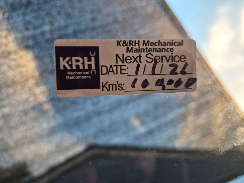 Real customers logo on our service due stickers, custom made to order for K&RH Mechanical Maintenance sticker on a car window with service details.