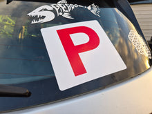 Load image into Gallery viewer, P-plate on a car window with decorative elements.
