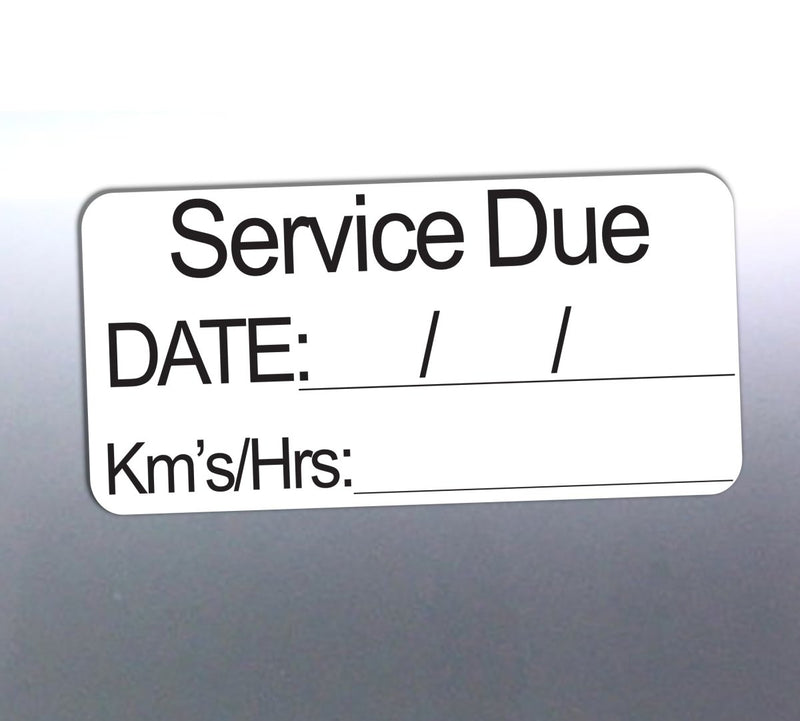 Service due label with fields for date and kilometers on a metallic background