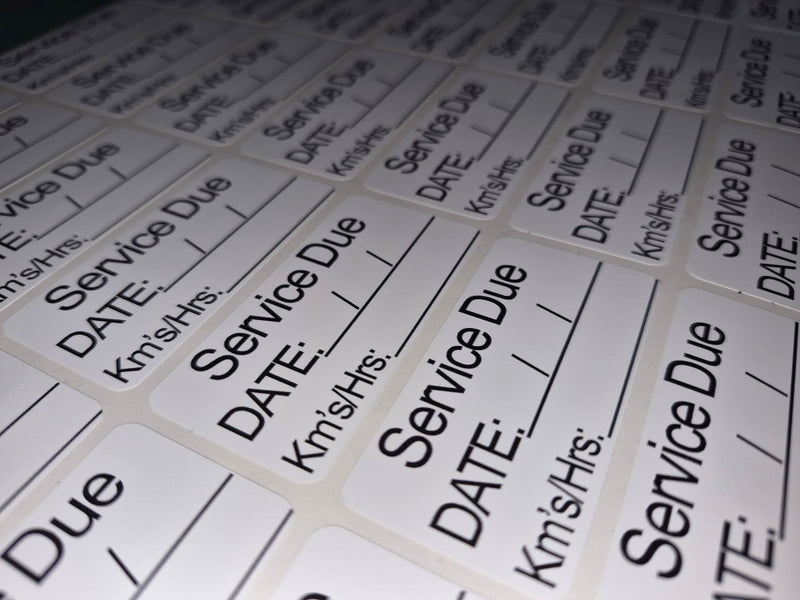 Sheet of labels with 'Service Due' text on a white background