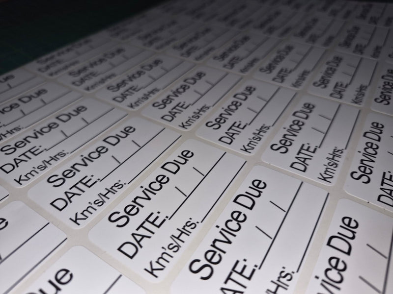 Sheet of pre-printed labels with 'Service Due' text on a white background