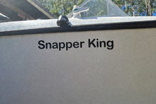 Load image into Gallery viewer, Decal on a Boat's side with 'Snapper King' text, outdoors.
