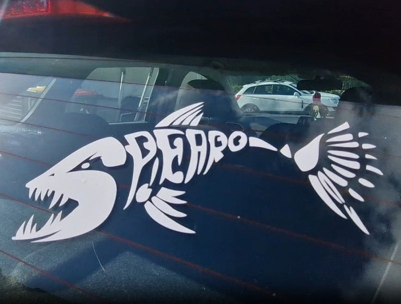 White fish skeleton decal on a car window with 'SPREARO' text.