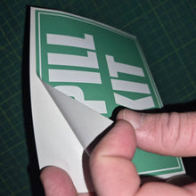 Load image into Gallery viewer, Hand holding a green and white 'Spill Kit' sign on a grid background
