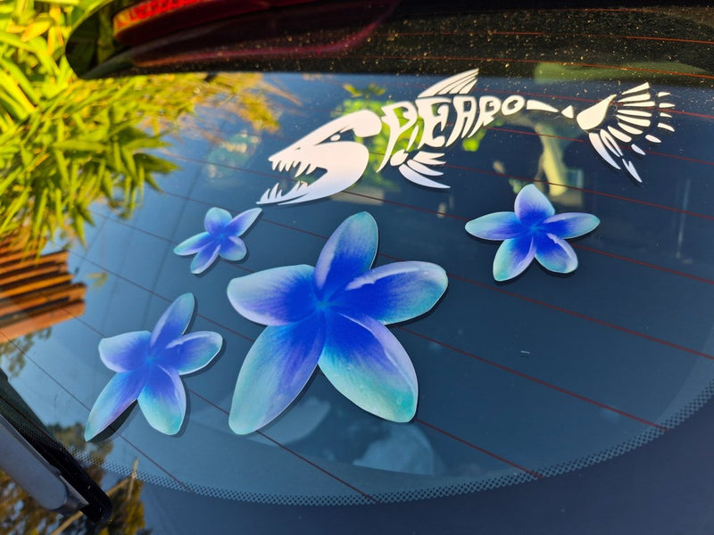 Frangipani Blue flower decals on a car window with a visible brand logo in the background.