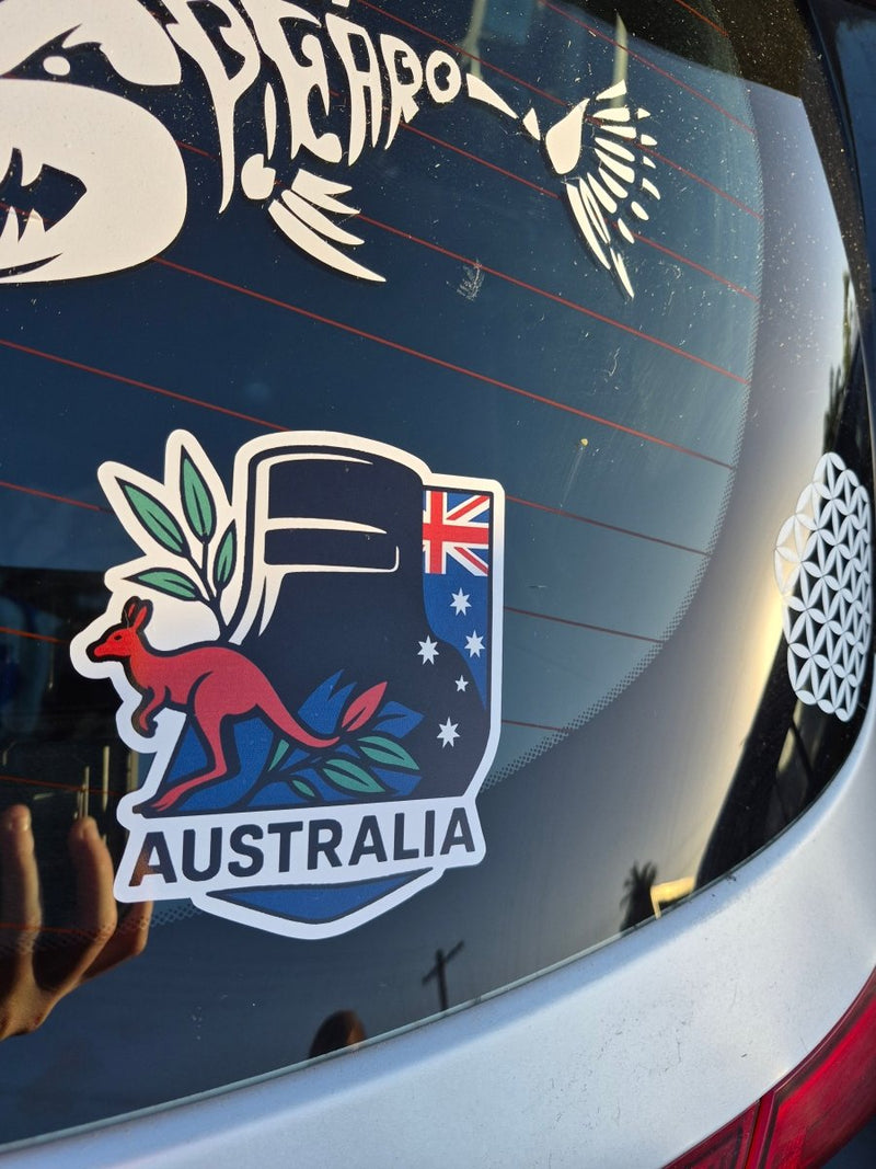Ned Kelly Australia-themed decal on a car window with kangaroo and emu designs.