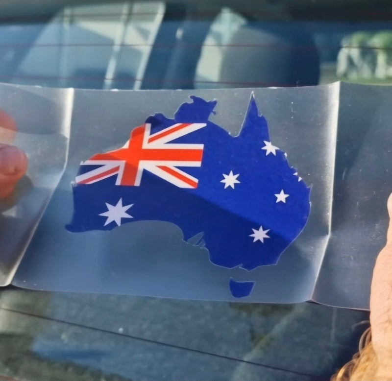 Sticker of Australia's flag and map on a car window
