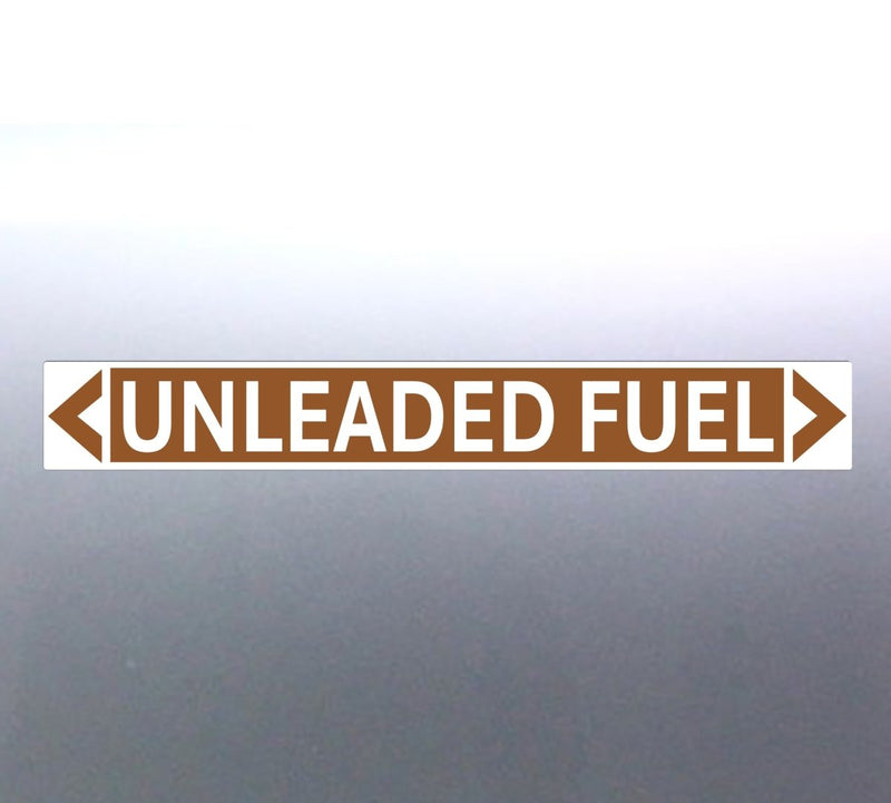 A pipe marker sign with the text 'UNLEADED FUEL' in bold black lettering on a golden tan background with a white border and green arrows indicating flow direction.