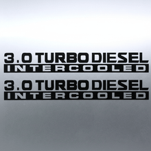 Load image into Gallery viewer, Black 3.0 Turbo Diesel Intercooled stickers on grey panel
