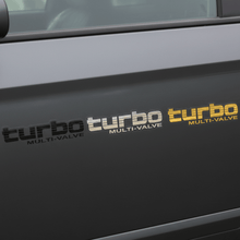 Load image into Gallery viewer, Black, silver and gold Turbo Multi-Valve stickers side by side
