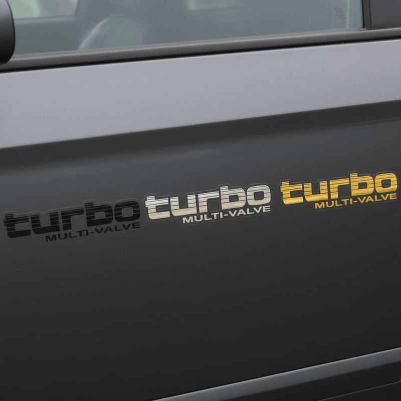 Black, silver and gold Turbo Multi-Valve stickers side by side