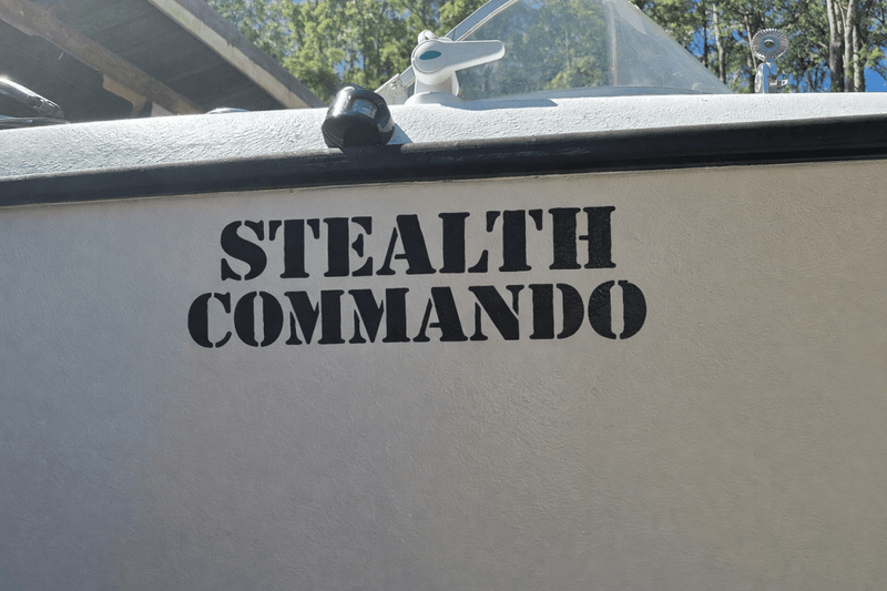 Boat with 'Stealth Commando' decal on a sunny day