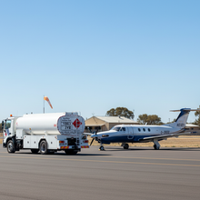 Load image into Gallery viewer, Bowser beside private jet
