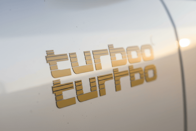 Close-up gold Turbo sticker on 4WD panel