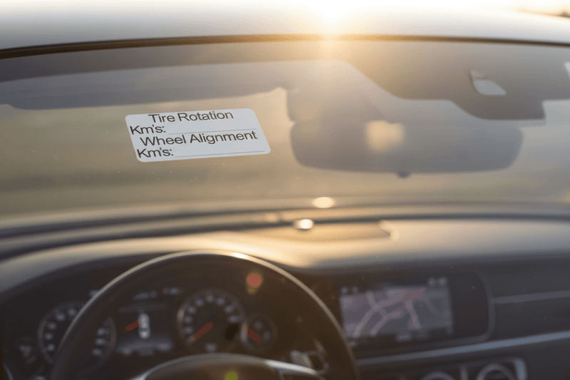 Close-up windscreen Tire Rotation & Wheel Alignment Stickers