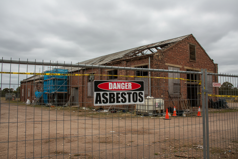 Danger Asbestos on chain-link fence