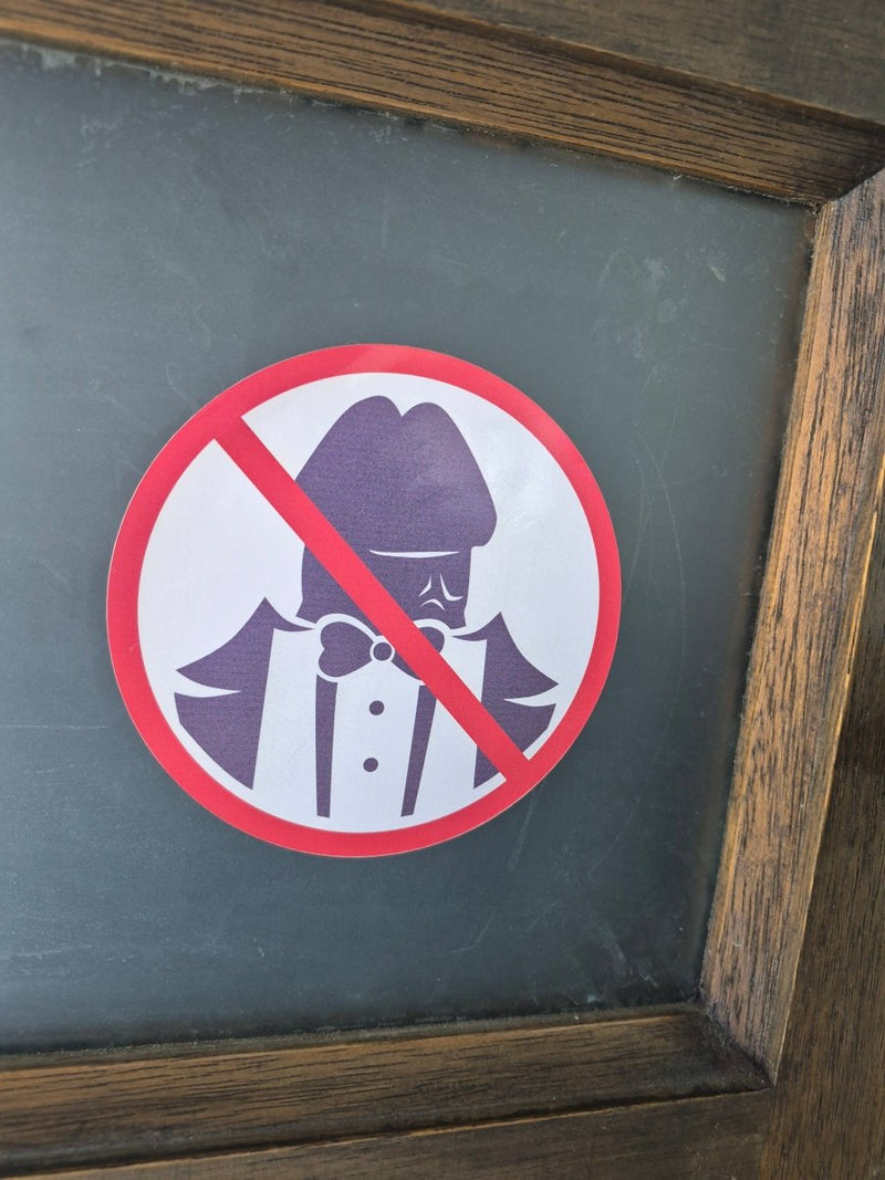 No Dickheads Allowed decal on a chalkboard with wooden frame