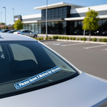 Load image into Gallery viewer, Disabled parking sticker on car rear window
