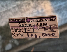 Load image into Gallery viewer, double sided Service due sticker on a car window with 'Midnight Performance' branding

