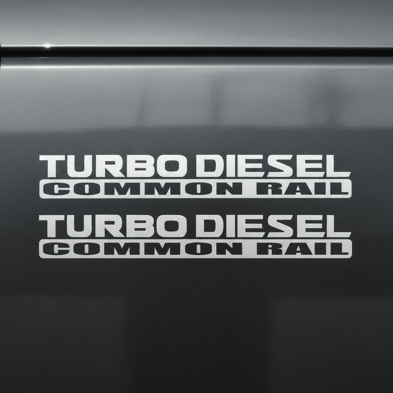 Flat silver-grey Turbo Diesel Common Rail stickers on dark background