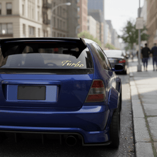 Load image into Gallery viewer, Gold Gothic Turbo sticker on JDM hatchback rear window

