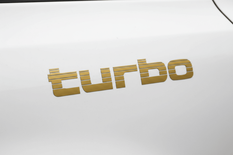 Gold Turbo sticker white door panel overcast