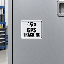 Load image into Gallery viewer, GPS Tracking Sticker on a silver equipment storage cabinet door
