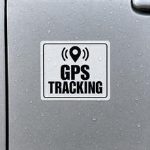 Load image into Gallery viewer, GPS Tracking Sticker on a silver vehicle door with water droplets on the white label

